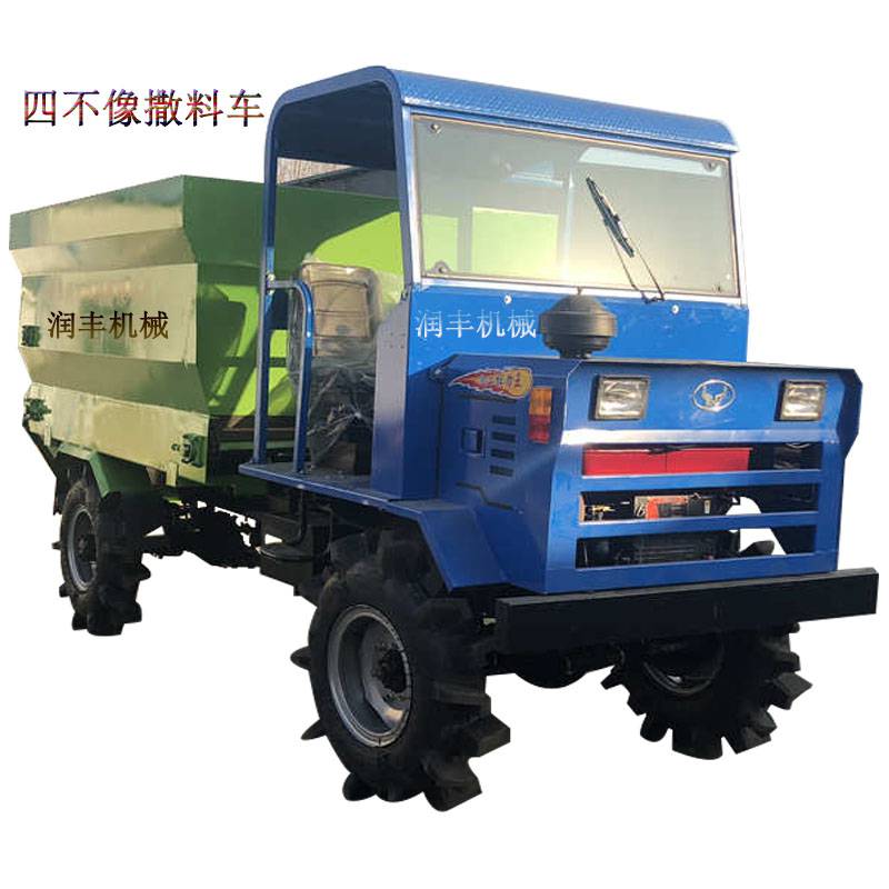 柴油撒料车图片四轮投料机牛羊喂料车价格